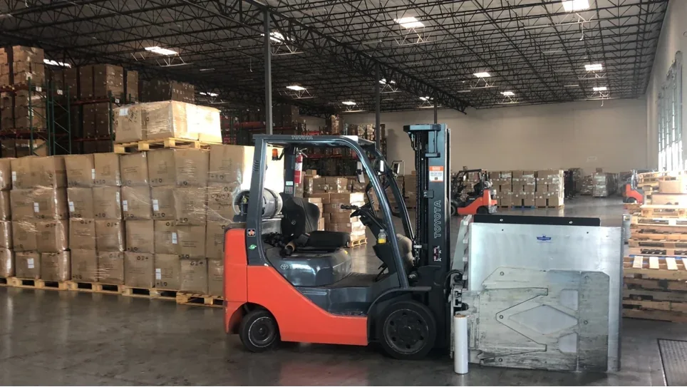 Forklift handling freight inside a warehouse